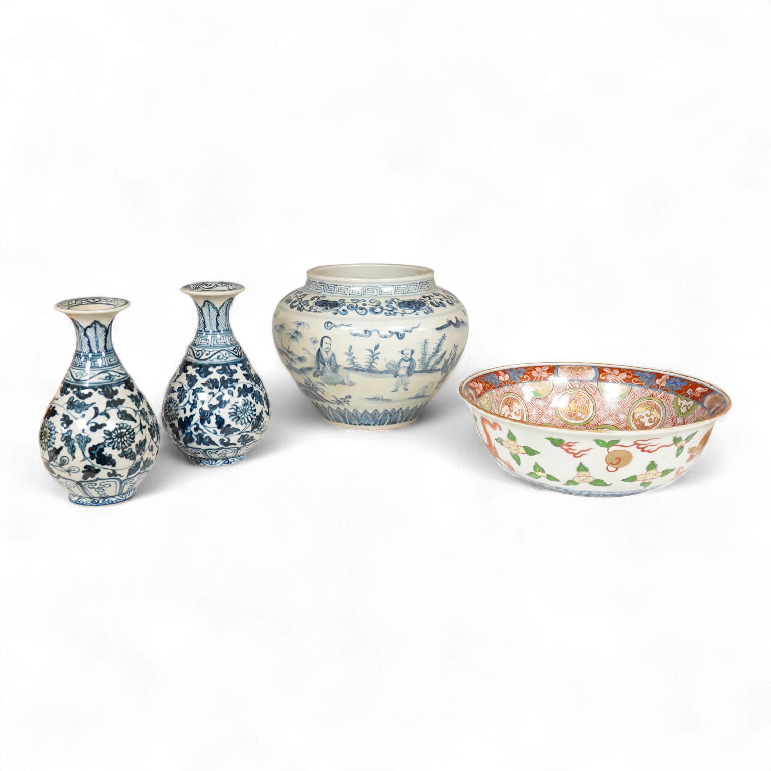 A pair of Chinese blue and white pear shaped vases, a similar jar and a Japanese bowl, largest 23cm in diameter